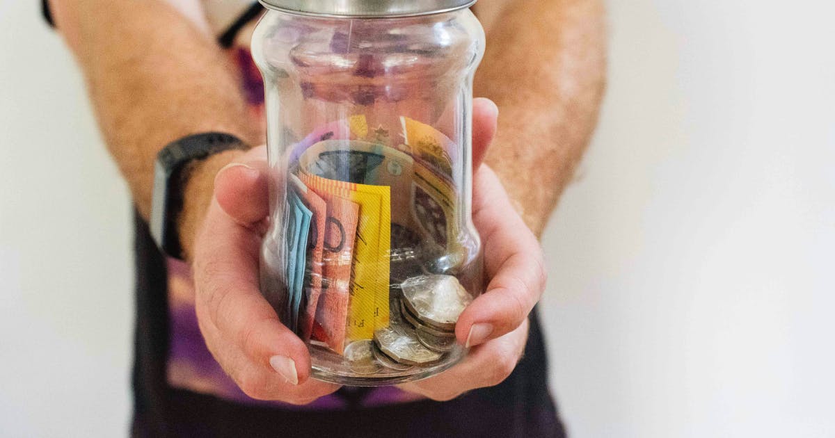 A petty cash reconciliation form helps businesses track small cash expenses, ensuring accuracy in funds stored in a jar with notes and coins.