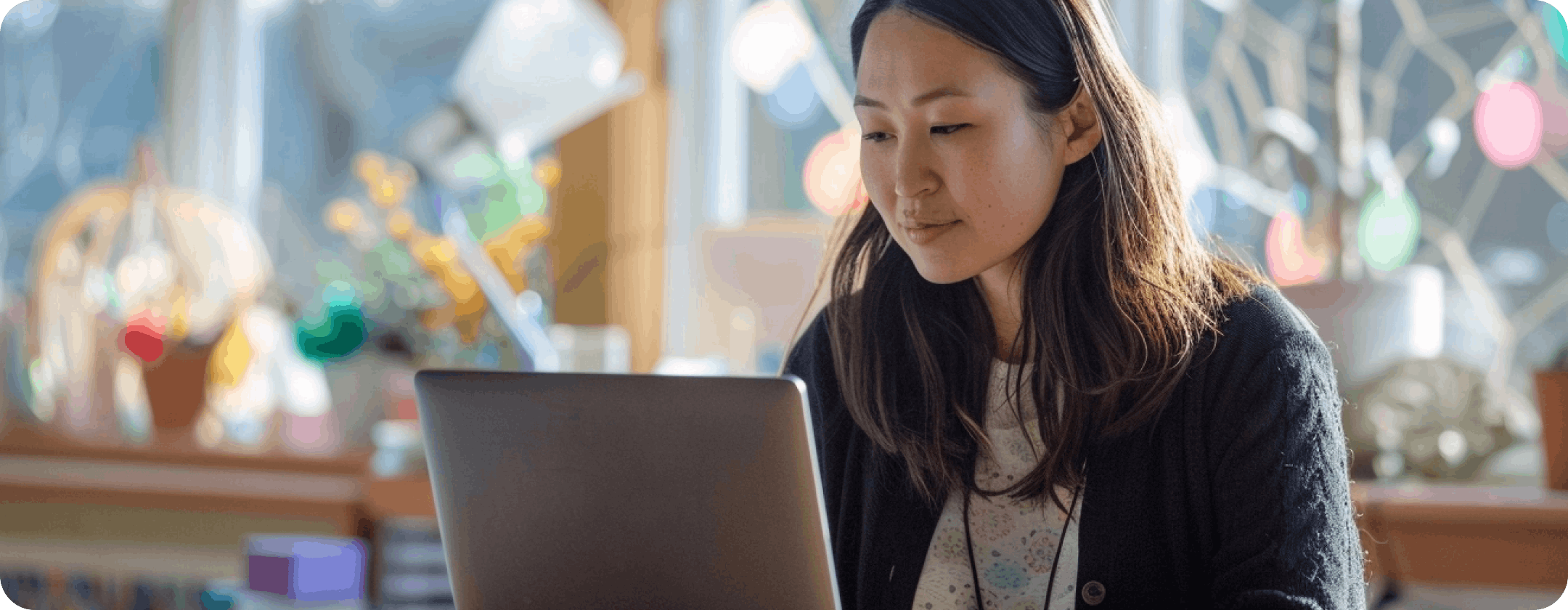 Teacher on laptop in school